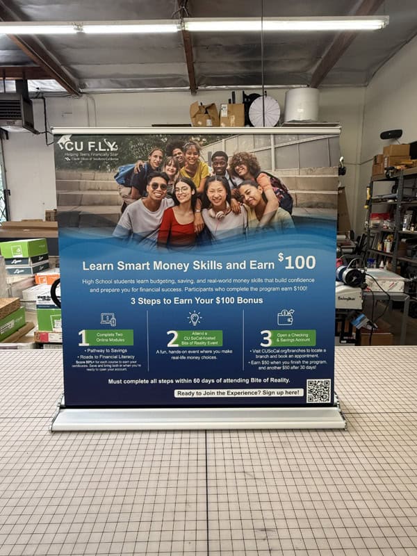 A retractable banner stand displayed on a table