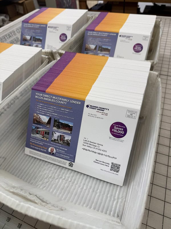 postcards in a mail tray on a table