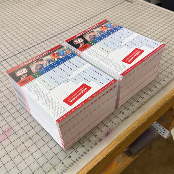 Flyers stacked on a table