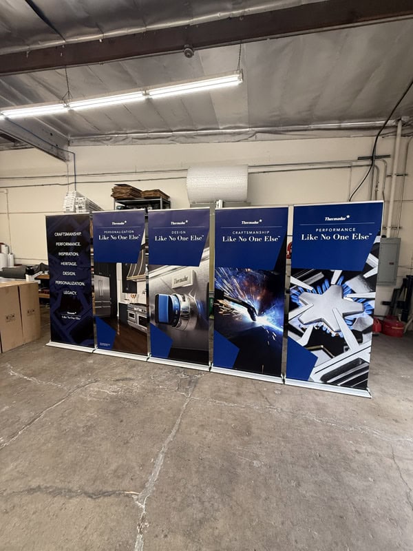 A group of Retractable banner stands in a. warehouse